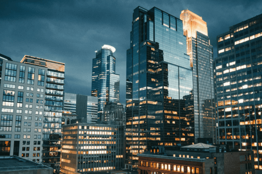 city skyscrapers lit up at night